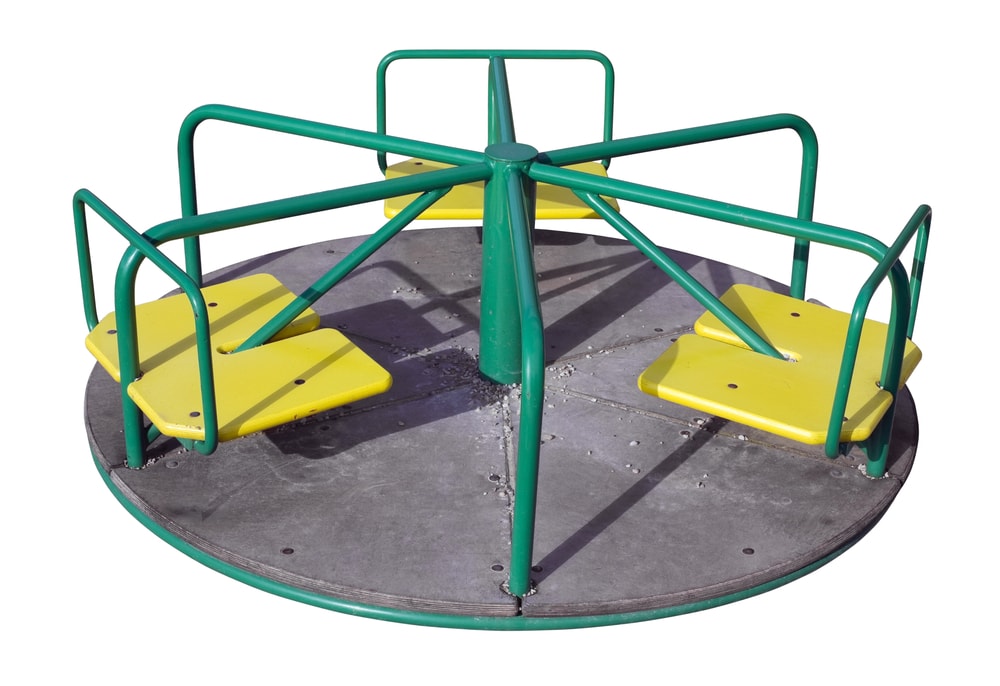 Small,Simple,Mechanical,Roundabout,Carousel,On,The,Children's,Playground.,Isolated
